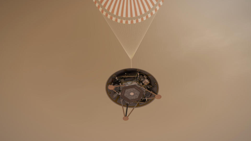 <p>Una recreación artística de la sonda de la NASA en su descenso en paracaídas hacia la superficie de Marte. (Nasa/JPL-Caltech/PA) </p>