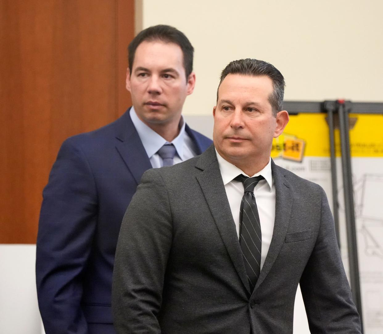 William Husel, left, and defense attorney Jose Baez stand as Husel's trial continued in the Franklin County Court of Common Pleas on Monday, Feb. 28