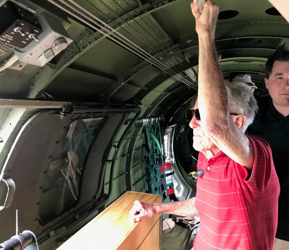 Evansville World War II veteran Allen Sanderson looks out the window of a B-17 on June 3, 2019. He flew 118 combat missions during the war, including two on D-Day.