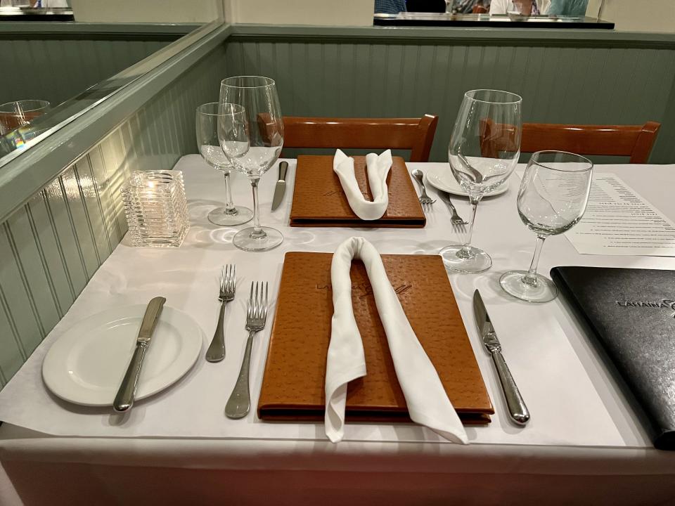 Lahaina Grill table setting with napkins on top of menues