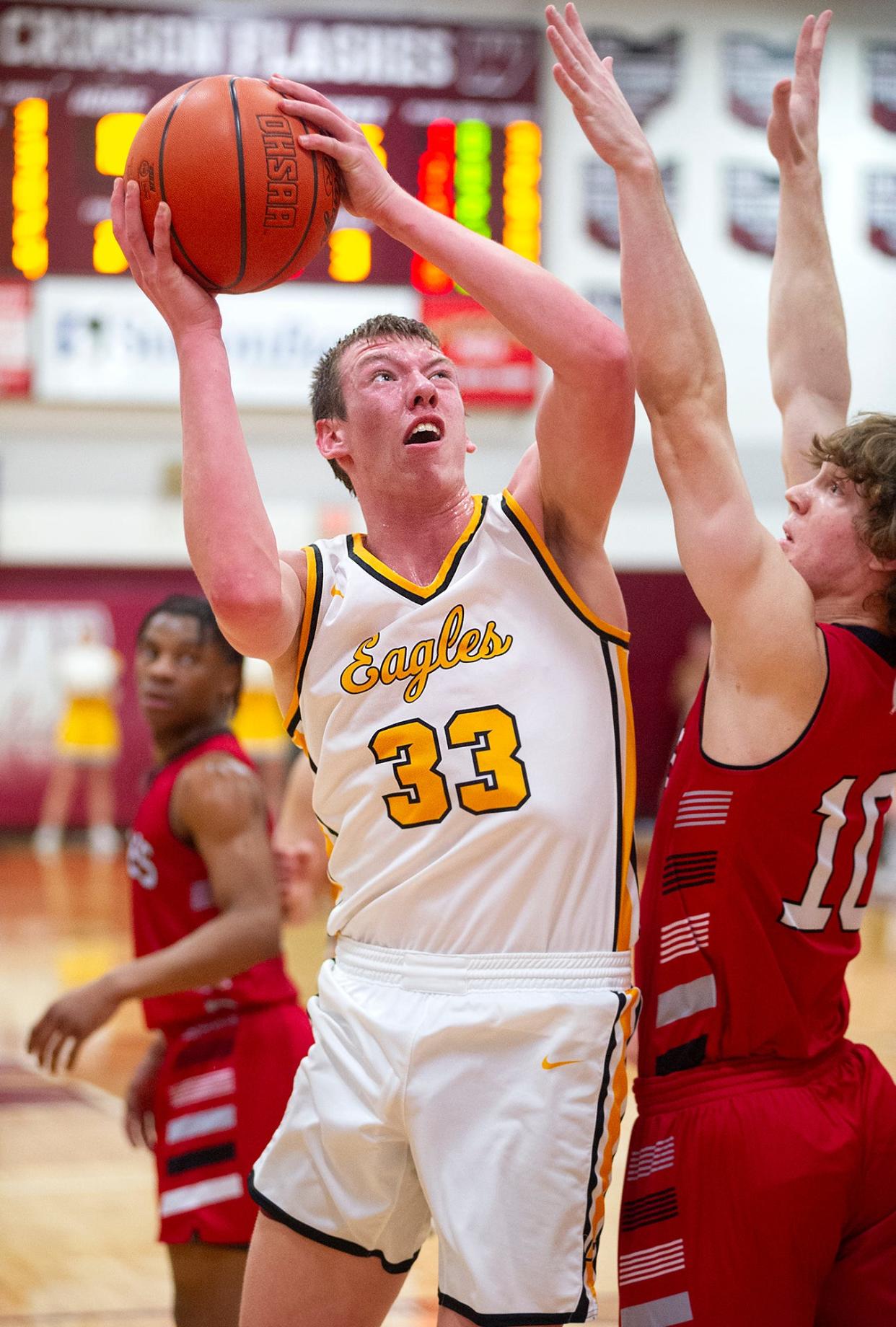 Colonel Crawford's Payne Degray shoots over Mansfield Christian's Gabe Westfield.