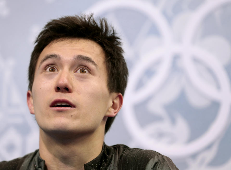 Patrick Chan of Canada waits for his results after the men's short program figure skating competition at the Iceberg Skating Palace during the 2014 Winter Olympics, Thursday, Feb. 13, 2014, in Sochi, Russia. (AP Photo/Ivan Sekretarev)