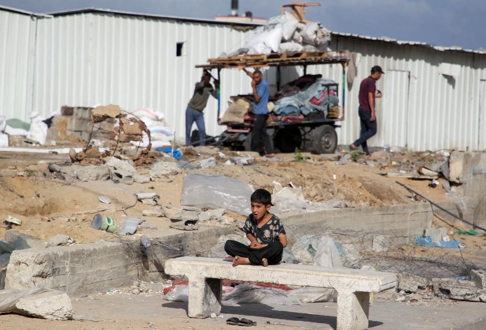 A boy looks on as Palestinians prepare to flee Rafah after Israeli forces launched a ground and air operation in the eastern part of the southern Gaza city (REUTERS)