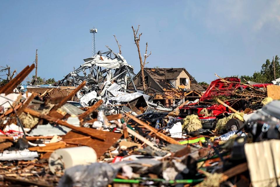 Debris covers a residential area in Perryton, Texas, Thursday, June 15, 2023, after a tornado struck the town.
