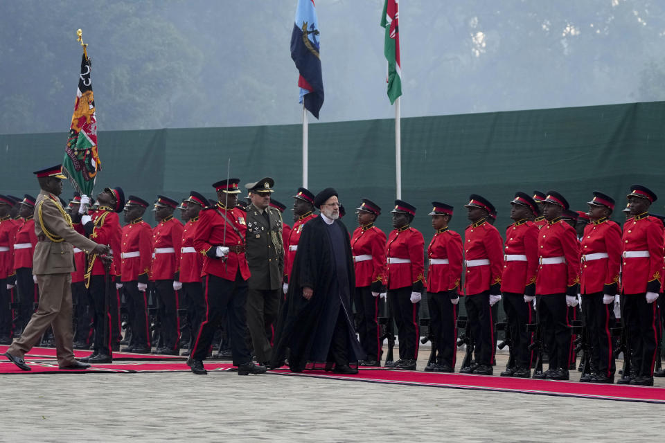 Iran's President Ebrahim Raisi inspects the honor guard before meeting with Kenya's President William Ruto at State House in Nairobi, Kenya Wednesday, July 12, 2023. Iran's president has begun a rare visit to Africa as the country, which is under heavy U.S. economic sanctions, seeks to deepen partnerships around the world. (AP Photo/Khalil Senosi)