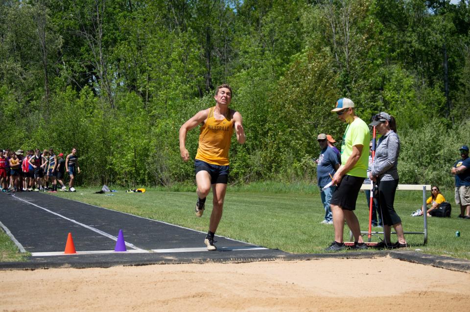 Hillsdale Hornet Peter Moore competes in the long jump event