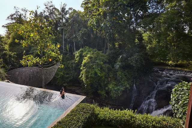 <p>Armelle Habib</p> The infinity pool at Baliâ€™s Nirjhara resort overlooks a natural waterfall.