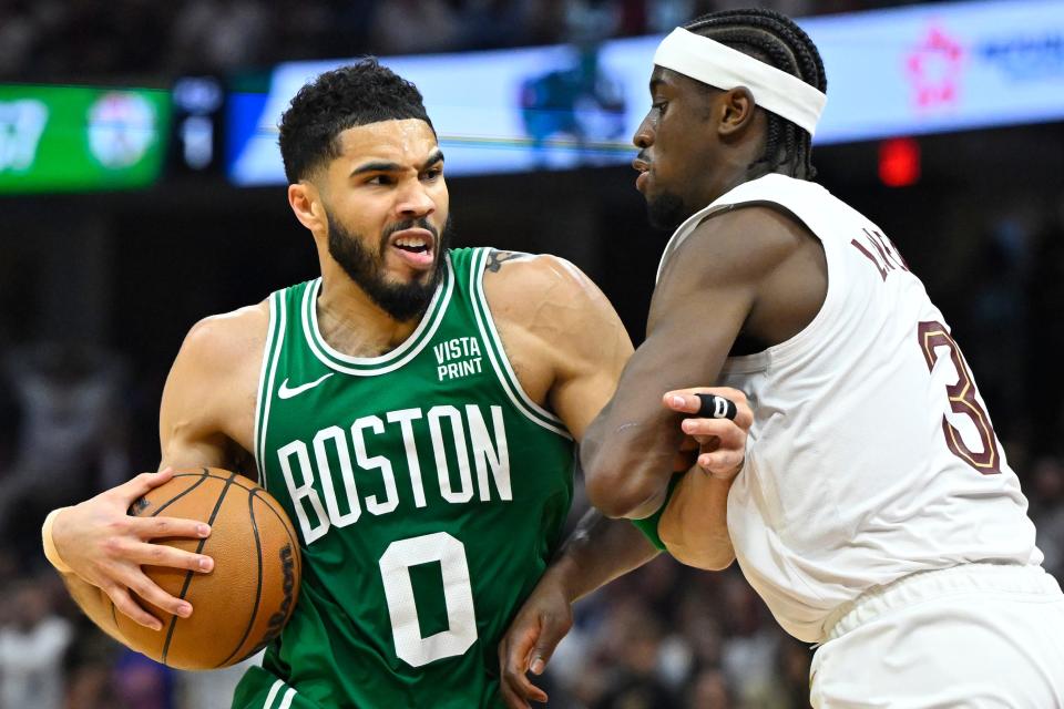 Jayson Tatum (0) drives against the Cleveland Cavaliers' Caris LeVert during Game 4.