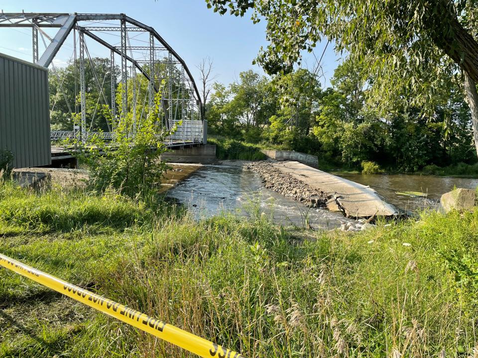 Water flows through a breach in the dam on the Maple River west of Elsie in Duplain Township on Saturday, Aug. 19, 2023.