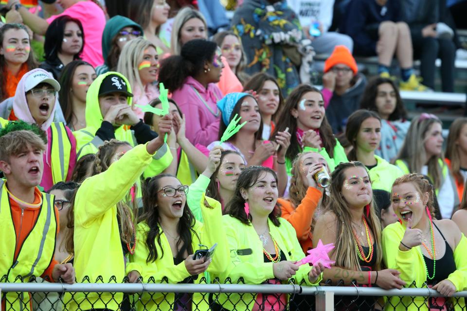 Fans cheer excitedly during a Dover versus Spackenkill High School football game on Sept. 23, 2022. The teams competed in the 8-man league last season but both are expected to return to 11-player football in 2023.
