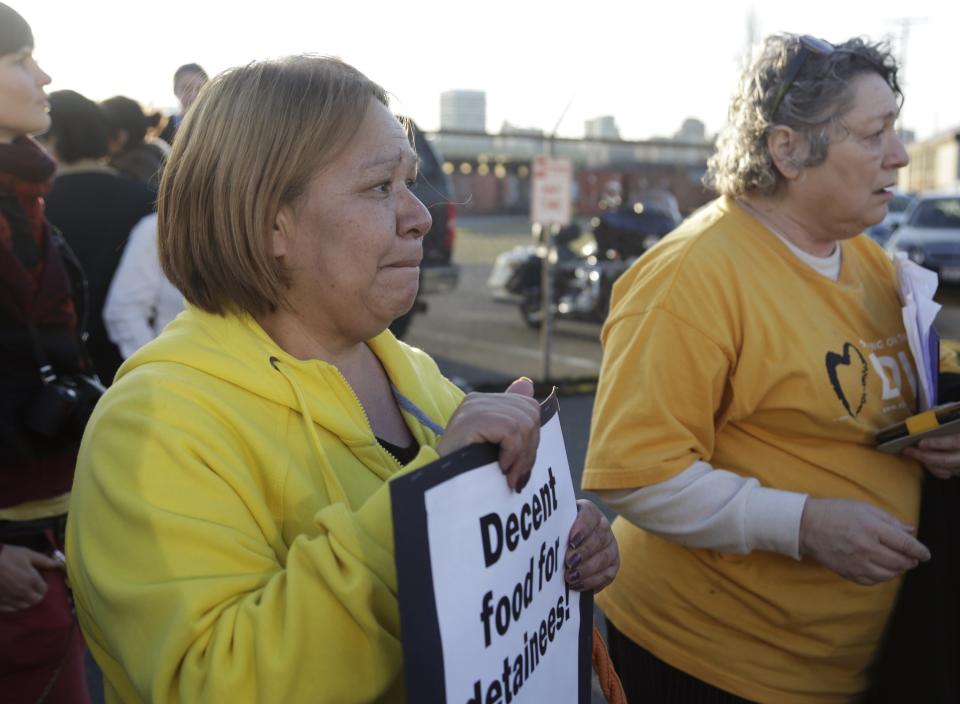 Rocio Zamora (L) of Santa Ana, California, who says her son Alan Zamora, 27, of Bellevue, Washington has lived in the US since he was 3-years-old and was taken into custody recently, rallies with immigrants rights supporters outside the US Immigration Customs Enforcement (ICE) Northwest Detention Center in Tacoma, Washington on March 11, 2014. Dozens of detainees on the fourth day of a hunger strike protesting U.S. deportations and detention center conditions at a Washington state immigration facility were being medically evaluated on Monday and could be force-fed, a federal agency said. REUTERS/Jason Redmond (UNITED STATES - Tags: SOCIETY IMMIGRATION POLITICS CIVIL UNREST)