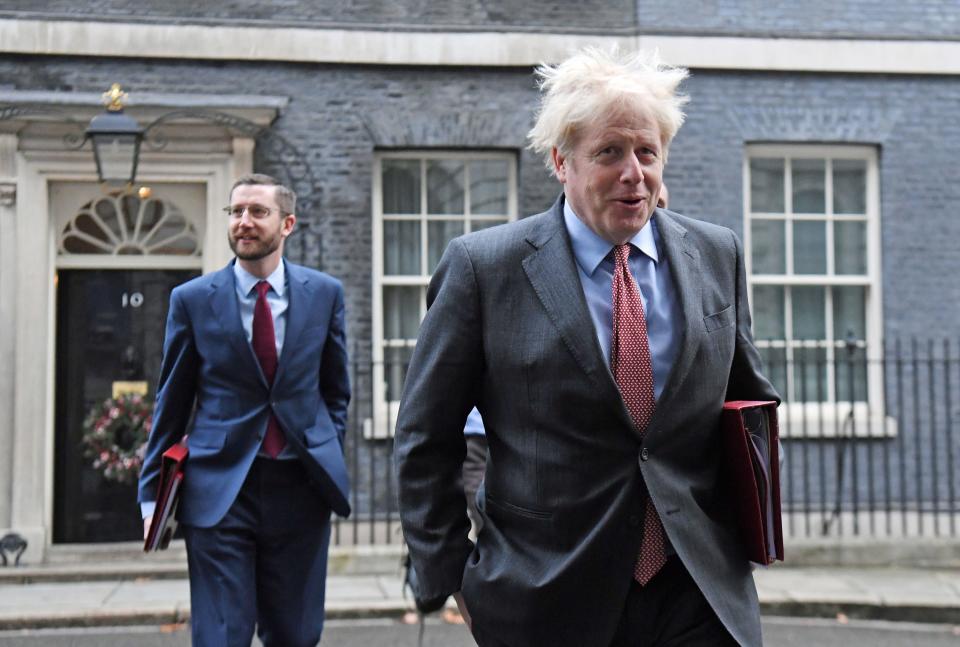 Simon Case pictured with Boris Johnson in Downing Street (PA)