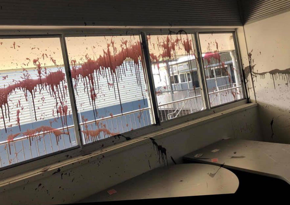 Windows splattered with paint. Source: Facebook/ Meridan State College