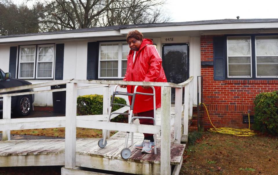 Vivian Nelson,70, stands in front of her house in Columbus, Georgia. Nelson’s broken A/C and heater were fixed for free through the weatherization program in early January. 1/16/2024. Kala Hunter/khunter@ledger-enquirer.com