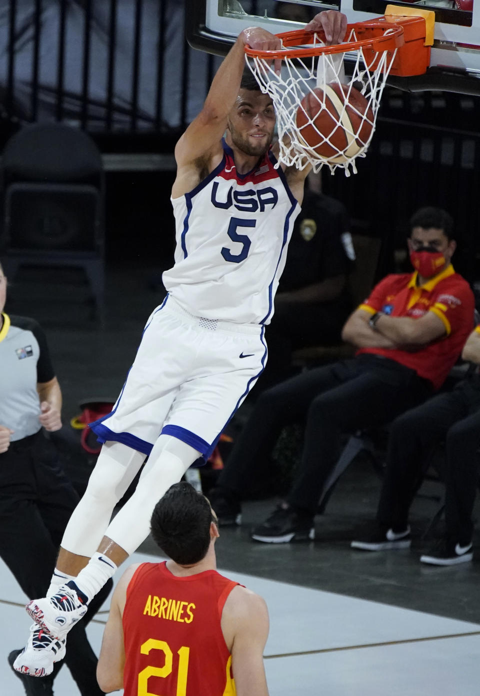 United States' Zach Lavine (5) dunks against Spain's Alex Abrines (21) during the second half of an exhibition basketball game in preparation for the Olympics, Sunday, July 18, 2021, in Las Vegas. (AP Photo/John Locher)