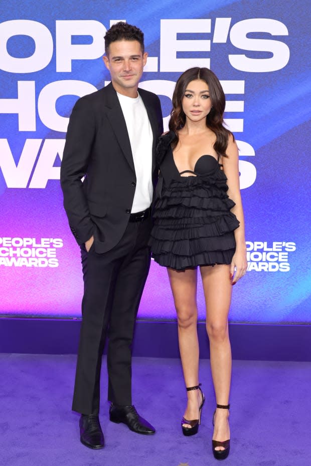 SANTA MONICA, CALIFORNIA - DECEMBER 06: (L-R) Wells Adams and Sarah Hyland attend the 2022 People's Choice Awards at Barker Hangar on <a href="https://parade.com/living/december-holidays-observances" rel="nofollow noopener" target="_blank" data-ylk="slk:December;elm:context_link;itc:0;sec:content-canvas" class="link ">December</a> 06, 2022 in Santa Monica, California. (Photo by Amy Sussman/Getty Images )<p><a href="https://www.gettyimages.com/detail/1447274834" rel="nofollow noopener" target="_blank" data-ylk="slk:Amy Sussman/Getty Images;elm:context_link;itc:0;sec:content-canvas" class="link ">Amy Sussman/Getty Images</a></p>