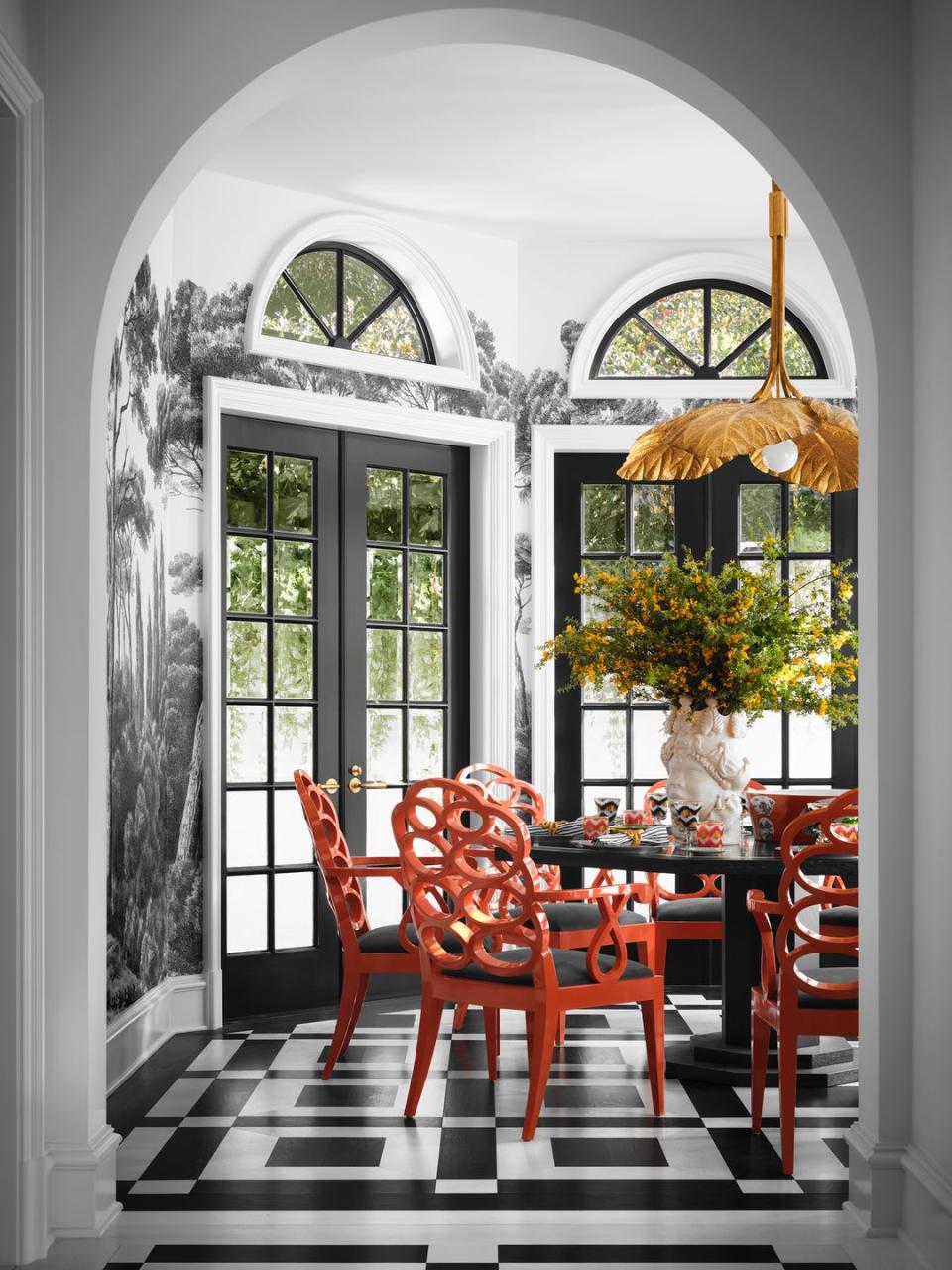 a dining room with a table and chairs