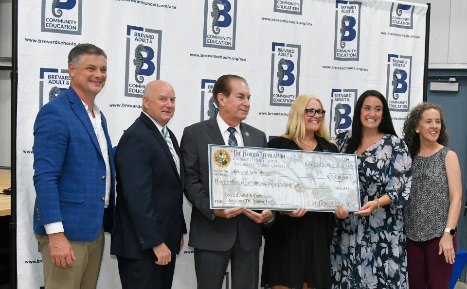On Aug. 1, an open house and check presentation at Clearlake Education Center in Cocoa heralded the upcoming Commercial Drivers License (CDL) facility projected to open in June 2024. Sen Tom Wright presented Brevard Public Schools and Brevard Adult Education with a ceremonial $3.8 million check to celebrate the funding. Pictured, left to right, are Brevard School Board Chair Matt Susin, Superintendent Mark Rendell, Sen. Tom Wright; Lorri Benjamin, diirector of adult and community education; and school board members Megan Wright and Katye Campbell.