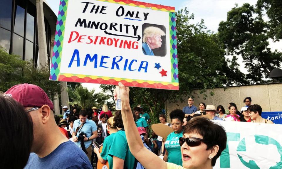 Activists protesting against Trump outside federal court in San Antonio, Texas. California’s legislation is more far-reaching than an existing sanctuary state policy in Oregon.