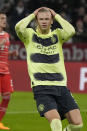 Manchester City's Erling Haaland reacts after missing a penalty kick during the Champions League quarter final second leg soccer match between Bayern Munich and Manchester City, at the Allianz Arena stadium in Munich, Germany, Wednesday, April 19, 2023. (AP Photo/Matthias Schrader)