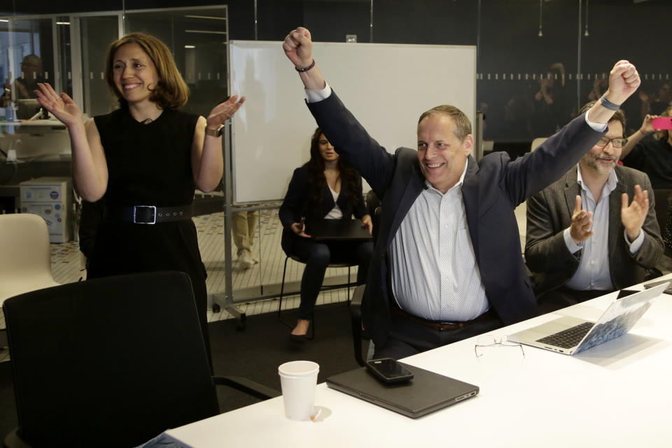 Associated Press Executive Editor Julie Pace, left, Director of Photography David Ake, center, and Paul Haven, Director of Global Newsgathering, celebrate on Monday, May 8, 2023, in New York after it was announced that the A.P. won a Pulitzer Prize in the public service category. The AP has won two Pulitzer Prizes in journalism for its coverage of the Russian invasion in Ukraine, in the categories of public service and breaking news photography. (AP Photo/Peter Morgan)