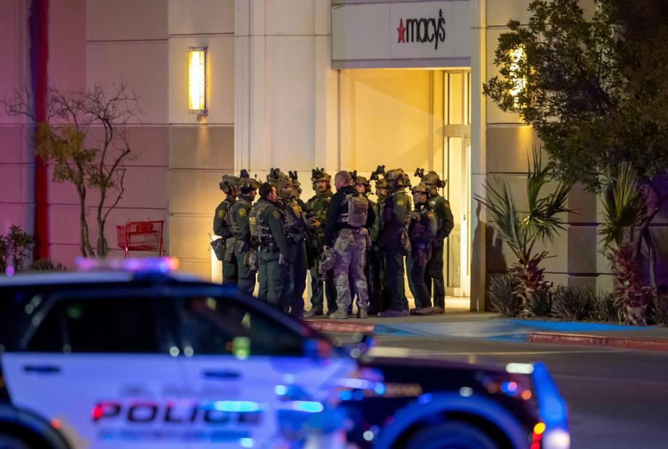 Police officers gather at an entrance of the shopping mall on Wednesday (Copyright 2023 The Associated Press. All rights reserved.)