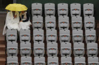 <p>Spectators hold an umbrella at Suzanne Lenglen court at the French Open in Paris, France, on May 31, 2016. (Reuters/Pascal Rossignol) </p>