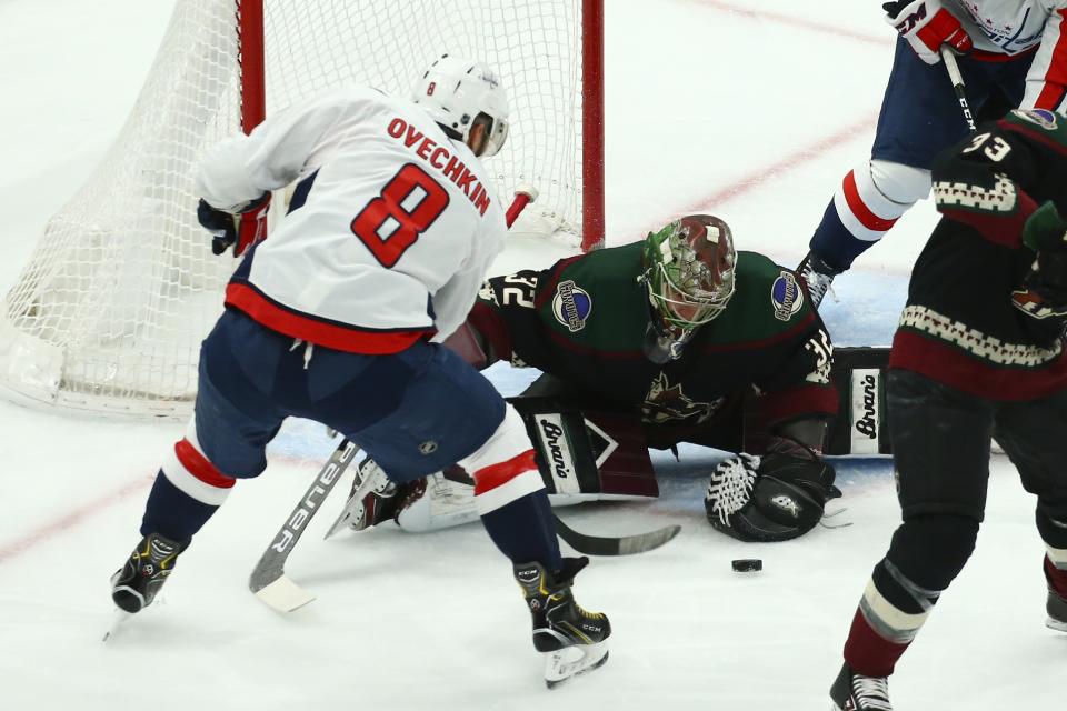 Washington Capitals left wing Alex Ovechkin (8) has his shot stopped by Arizona Coyotes goaltender Antti Raanta (32) during the first period of an NHL hockey game Saturday, Feb. 15, 2020, in Glendale, Ariz. (AP Photo/Ross D. Franklin)