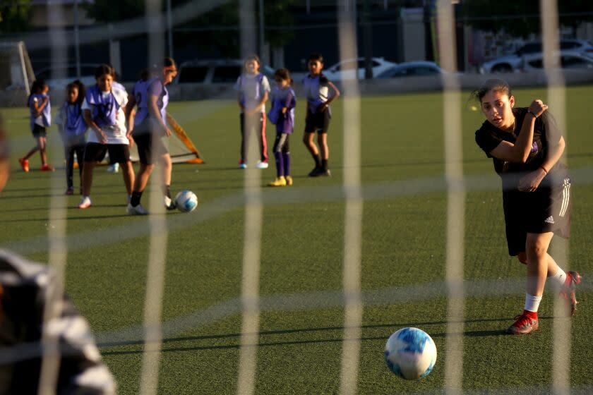 Nayelli Barahona rolls a ball to the goalkeeper during practice with the Downtown L.A. Soccer Club