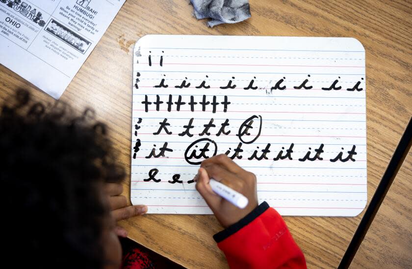 PASADENA-CA-DECEMBER 14, 2023: Fourth grade student Mandela Jones practices writing in cursive at Longfellow Elementary School in Pasadena on December 14, 2023. (Christina House / Los Angeles Times)