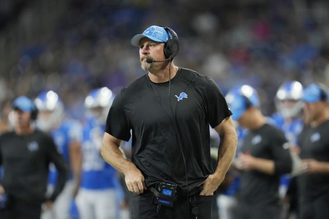 Detroit Lions quarterback Adrian Martinez (18) keeps the ball