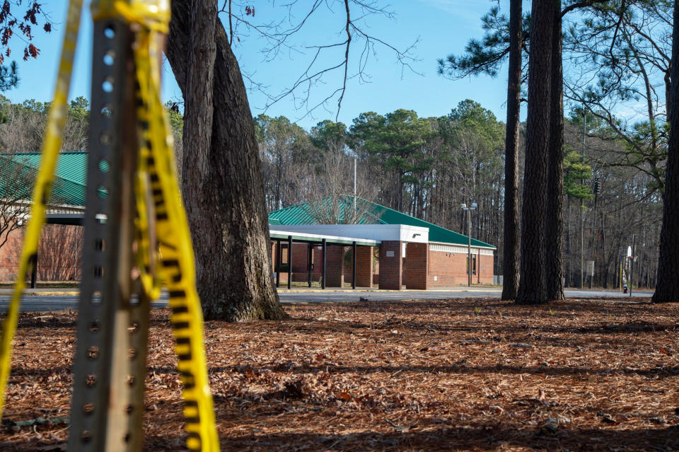 Police tape hangs from a sign post outside Richneck Elementary School (Jay Paul / Getty Images file)