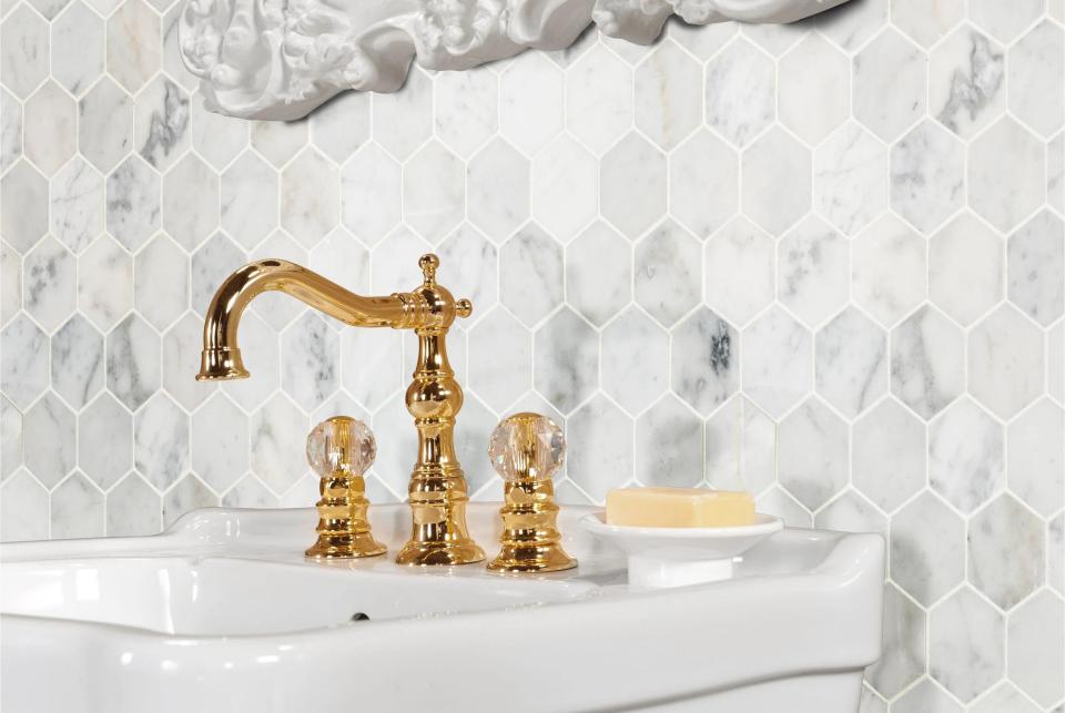 The honeycomb tile used as a backsplash behind a sink