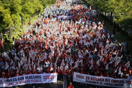 People in Madrid take part in a demonstration against government austerity measures aimed at slashing the public deficit and avoiding the need for a financial bailout, on September 15. The demonstrators gathered in groups along the central streets of the Spanish capital ahead of the rally which gets underway at noon at the Plaza Colon square which is expected to draw tens of thousands