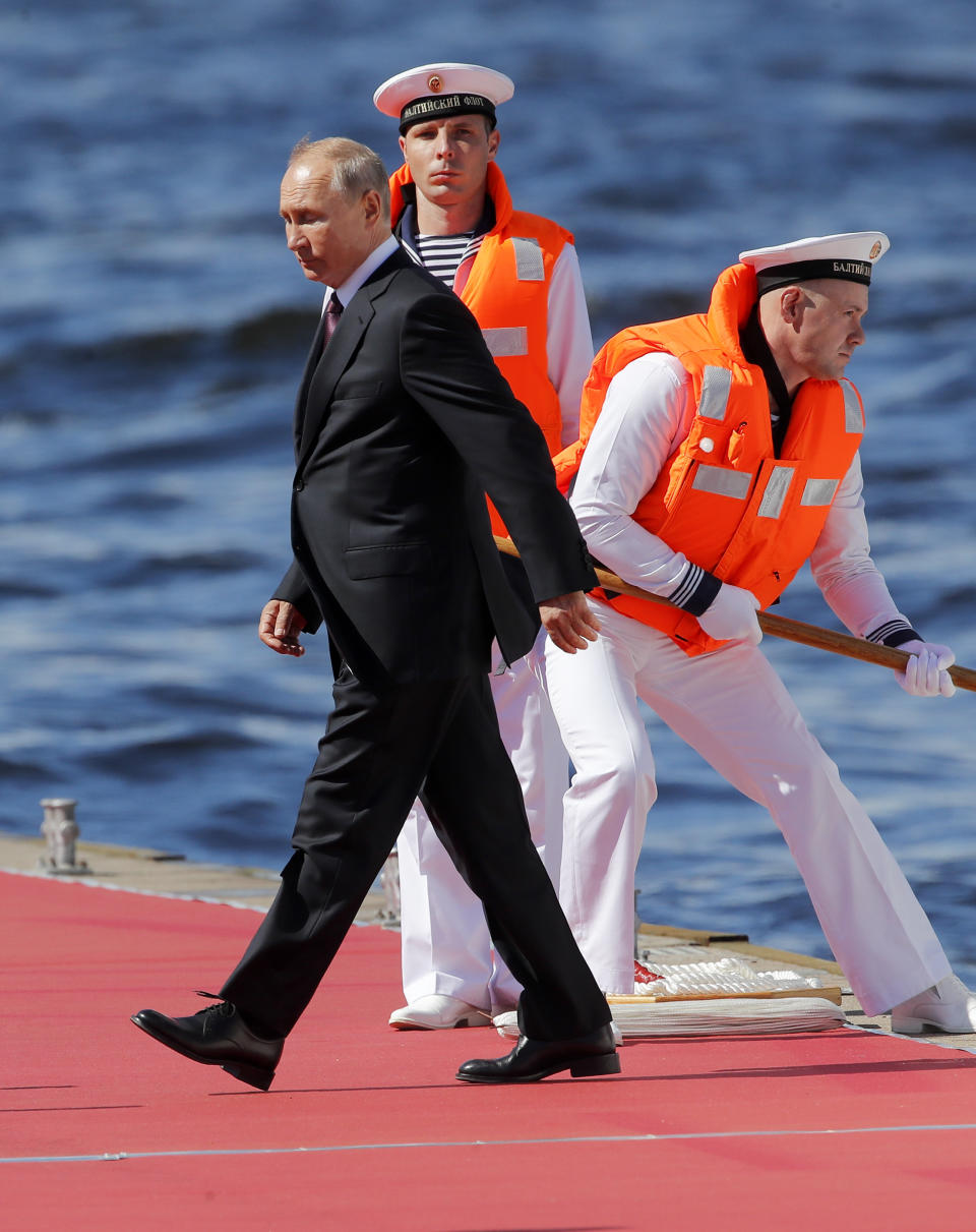 Russian President Vladimir Putin arrives to attend the military parade during the Navy Day celebration in St.Petersburg, Russia, Sunday, July 26, 2020.(AP Photo/Dmitri Lovetsky, Pool)