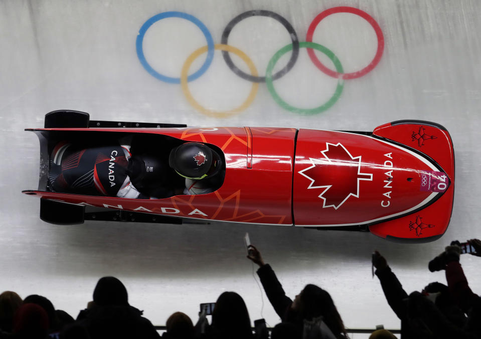 Driver Kaillie Humphries and Phylicia George of Canada take a curve in their first heat during the women’s two-man bobsled competition at the 2018 Winter Olympics in Pyeongchang, South Korea, Tuesday, Feb. 20, 2018. (AP Photo/Michael Sohn)