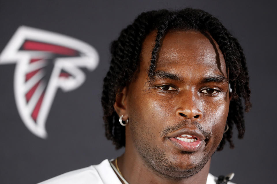 FILE - In this June 11, 2019, file photo, Atlanta Falcons wide receiver Julio Jones (11) speaks to reporters after an NFL minicamp football practice in Flowery Branch, Ga. For Julio Jones, it's just business as usual _ even as he closes in on a huge new contract with the Atlanta Falcons. (AP Photo/John Bazemore, File)