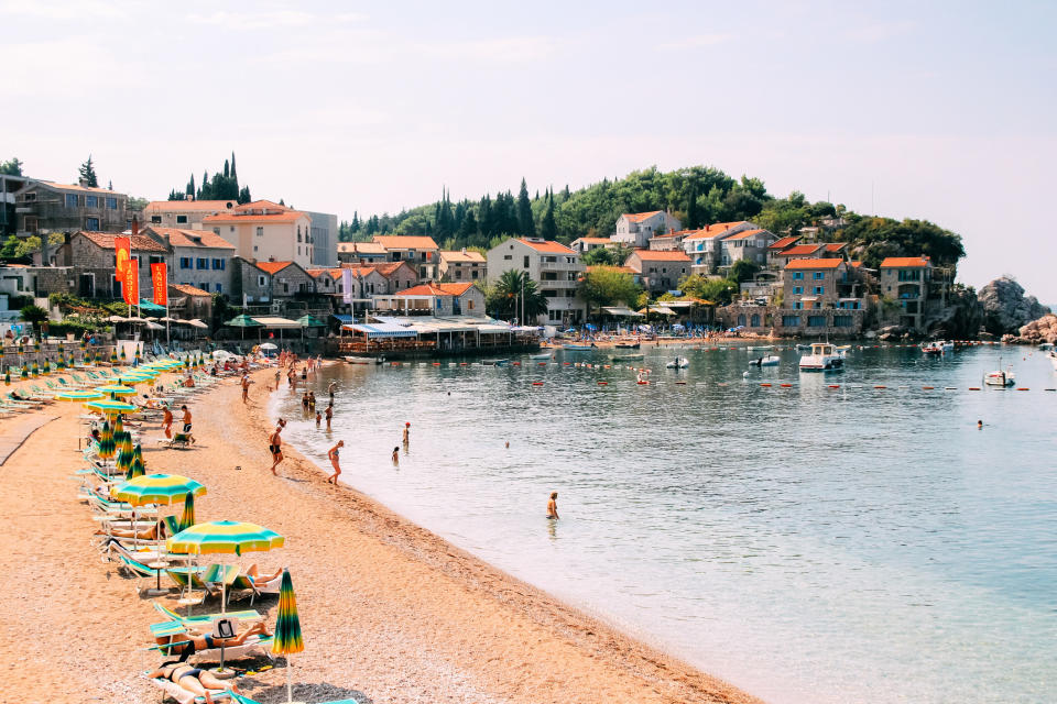 A beach with umbrellas in Montenegro.