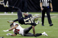 New Orleans Saints wide receiver Emmanuel Sanders (17) makes the catch as Tampa Bay Buccaneers strong safety Antoine Winfield Jr. (31) defends during the second half of an NFL divisional round playoff football game, Sunday, Jan. 17, 2021, in New Orleans. (AP Photo/Brett Duke)