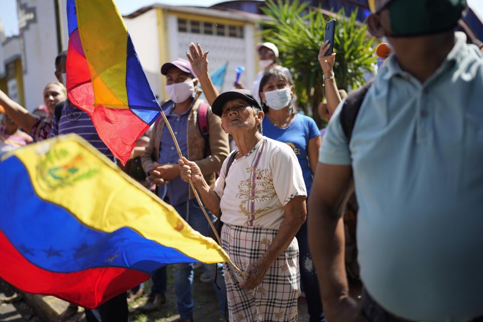 Supporters of opposition leader Freddy Superlano take part in a demonstration in Barinas, Venezuela, Saturday, Dec. 4, 2021. Superlano, who was leading the race for governor in Barinas State in the recent Nov. 21 regional elections, called for a protest this Saturday after a court ruling ordered new elections in the state and disqualified him from running. (AP Photo/Ariana Cubillos)