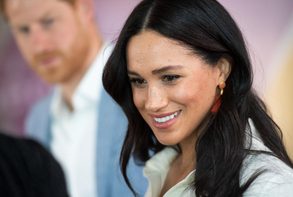 JOHANNESBURG, SOUTH AFRICA - OCTOBER 02: (UK OUT FOR 28 DAYS) Meghan, Duchess of Sussex accompanied by Prince Harry, Duke of Sussex visit the Tembisa Township to learn about Youth Employment Services during their royal tour of South Africa on October 02, 2019 in Johannesburg, South Africa.  (Photo by Pool/Samir Hussein/WireImage)