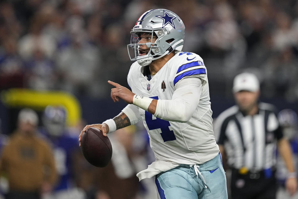 Dallas Cowboys quarterback Dak Prescott (4) scrambles in the first half of an NFL football game against the New York Giants, Sunday, Nov. 12, 2023, in Arlington, Texas. (AP Photo/Tony Gutierrez)