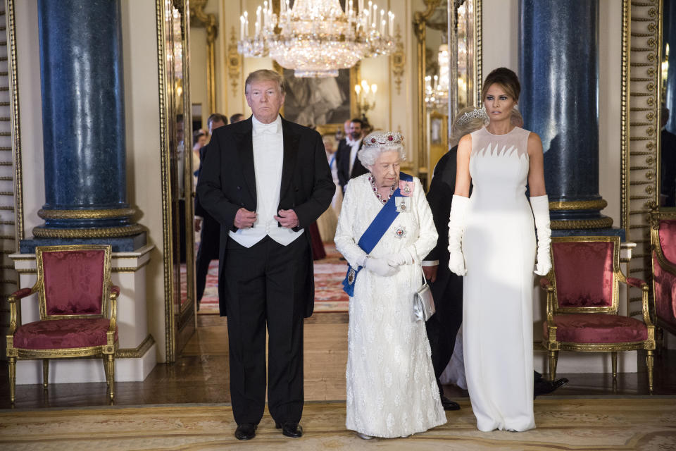 RETRANSMITTED CORRECTING BYLINE (left to right) US President Donald Trump, Queen Elizabeth II and Melania Trump, during a group photo ahead of the State Banquet at Buckingham Palace, London, on day one of US President Donald Trump's three day state visit to the UK.