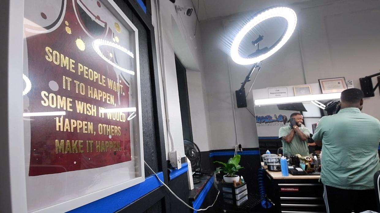 Johan Mendez, owner of Blendz Barber Shop in Chambersburg, trims his own hair between customers on Aug. 27 2024. He said he is leaning toward Trump. “It may be cool to have a woman president,” he said, “but we had Trump already, and he did good, I think. That’s how I see it.”