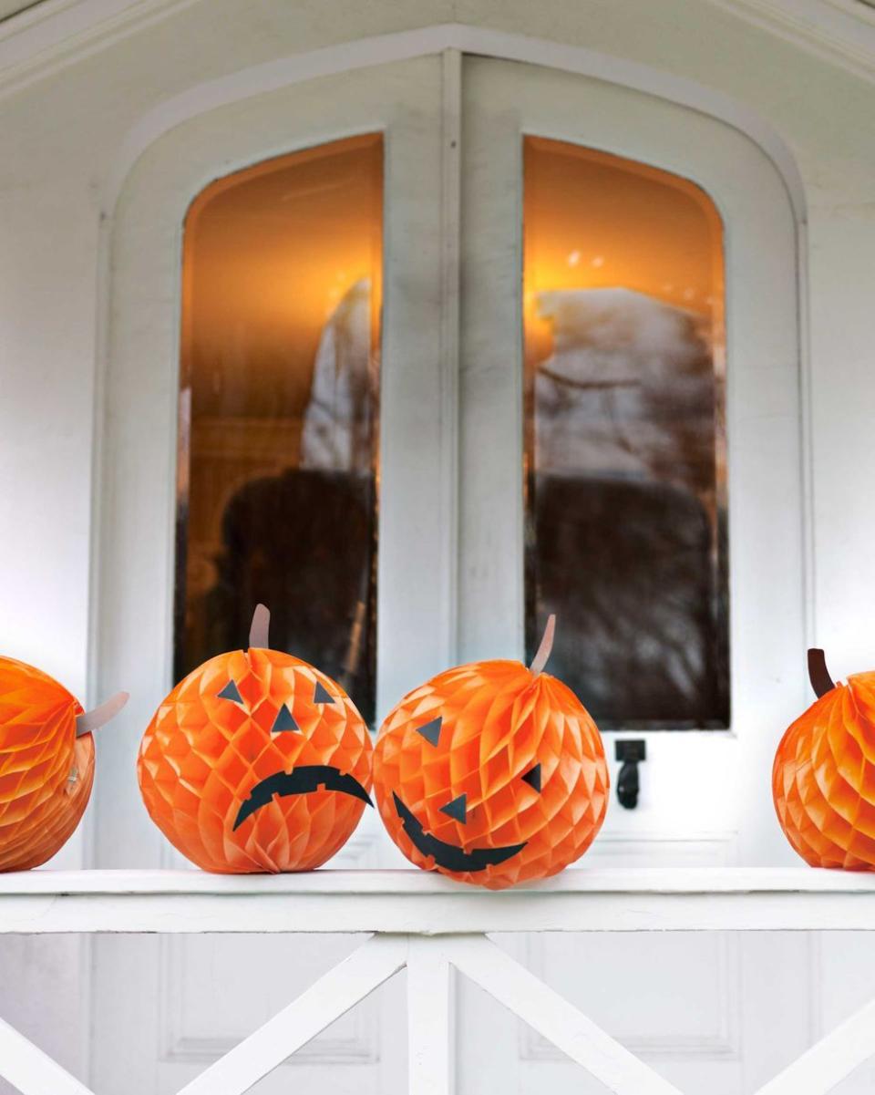 <p>Orange tissue paper balls can become fun jack-o'lanterns in an instant. Use black construction paper to cut their facial features and stems. </p><p><a class="link " href="https://go.redirectingat.com?id=74968X1596630&url=https%3A%2F%2Fwww.orientaltrading.com%2Ftissue-balls-orange-a2-3_3112.fltr&sref=https%3A%2F%2Fwww.goodhousekeeping.com%2Fholidays%2Fhalloween-ideas%2Fg33437890%2Fhalloween-table-decorations-centerpieces%2F" rel="nofollow noopener" target="_blank" data-ylk="slk:SHOP TISSUE PAPER BALLS;elm:context_link;itc:0;sec:content-canvas">SHOP TISSUE PAPER BALLS</a></p>