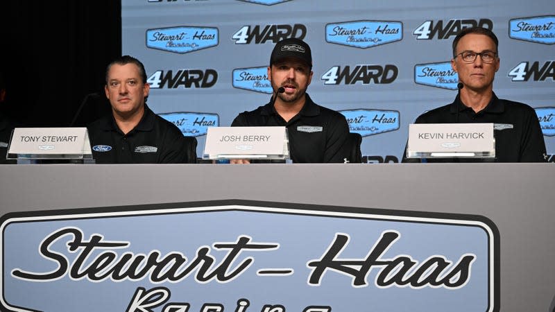 Co-owner Tony Stewart, driver Josh Berry and driver Kevin Harvick answer questions during a press conference introducing Berry as the new driver of the #4 Stewart-Hass Racing Ford Mustang at Charlotte Motor Speedway on June 21, 2023 in Concord, North Carolina.