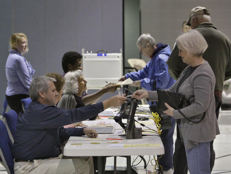 Voters in Cobb County, one of the largest precincts in the state, participate in the Georgia GOP primary on Tuesday, March 6, 2012, at Noonday Baptist Church in Marietta, Ga. Republican Presidential candidate Former House Speaker Newt Gingrich was favored to win in Georgia on Tuesday, but his rivals have spent time and resources in the state, hoping to grab a share of the state’s 76 delegates.(AP Photo/Atlanta Journal & Constitution, Bob Andres) MARIETTA DAILY OUT; GWINNETT DAILY POST OUT