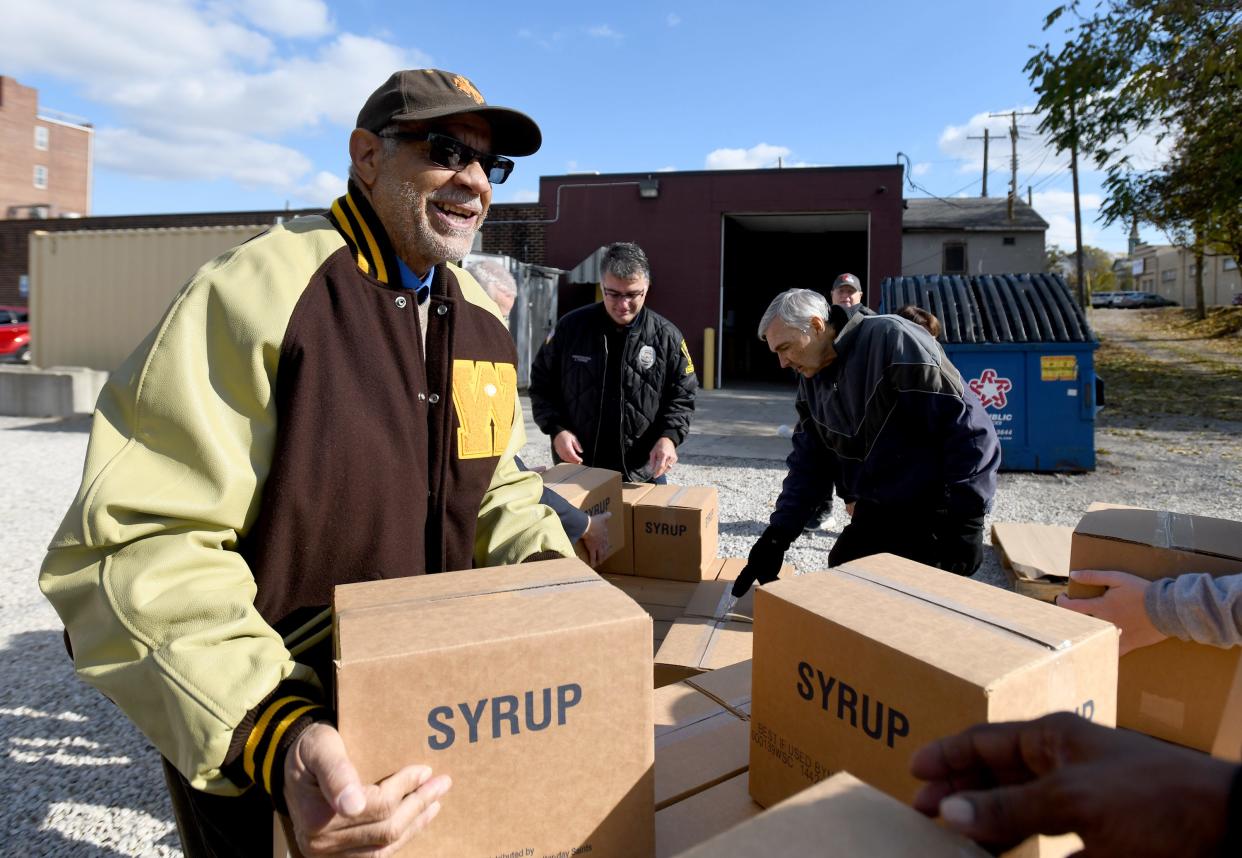 Alliance native Lionel Grimes, a member of the Black 14 from the University of Wyoming football team, partnered with the Church of Jesus Christ of Latter-day Saints to distribute donations to food pantries all over the country. They stopped Friday at the Alliance Community Food Pantry.
