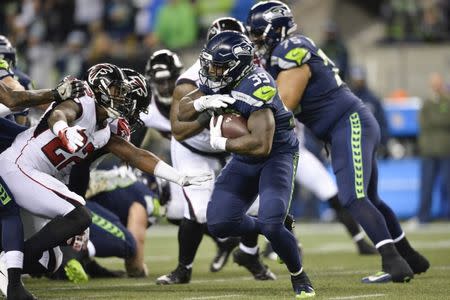 Nov 20, 2017; Seattle, WA, USA; Seattle Seahawks running back Mike Davis (39) carries the ball against the Atlanta Falcons during the first half at CenturyLink Field. Atlanta defeated Seattle 34-31. Steven Bisig-USA TODAY Sports