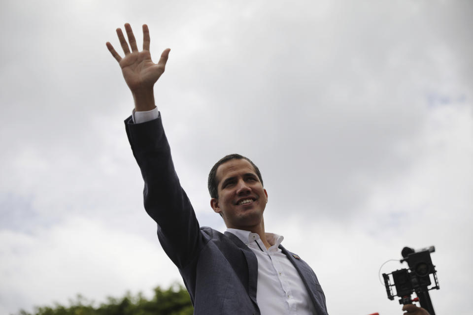 Opposition leader Juan Guaidó greets supporters as he arrives to lead a rally in Caracas, Venezuela, Saturday, May 11, 2019. Guaidó has called for nationwide marches protesting the Maduro government, demanding new elections and the release of jailed opposition lawmakers. (AP Photo/Rodrigo Abd)